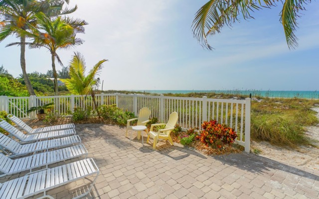 Pool Patio with Chaise Lounges and Adirondack Chairs